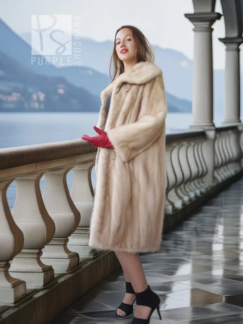Golden Pearl mink fur coat with shawl collar, cream tone, mid-length hem.