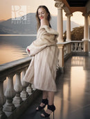 Golden Pearl mink fur coat with shawl collar, cream tone, long sleeves.