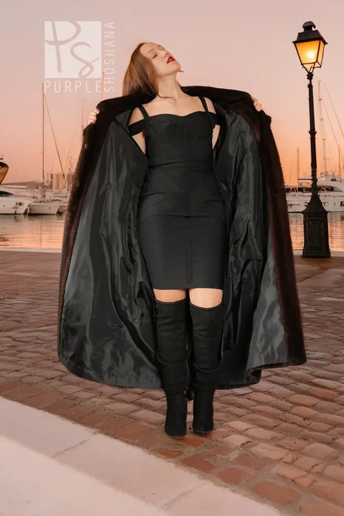 Black reversible outer layer of mink coat with long drape and open front, sleeved.