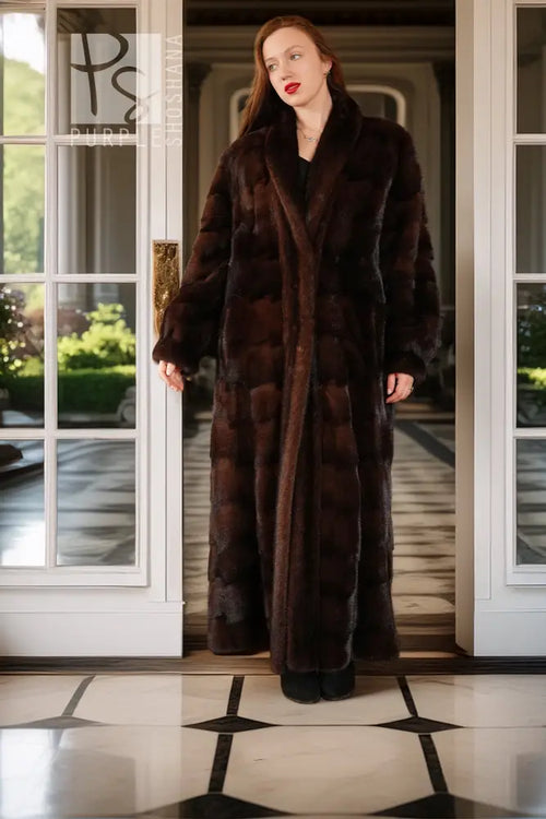 Dark brown mink coat with long sleeves and open V-neck design, floor-length hem.