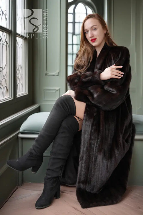 Dark mink fur coat with thick collar, long length, open front and plush cuffed sleeves