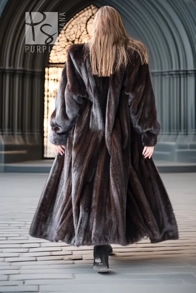 Dark mink fur coat with long skirted back and plush sleeves, open center