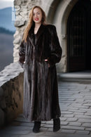 Black mink coat with notched collar, long front and full-length hem