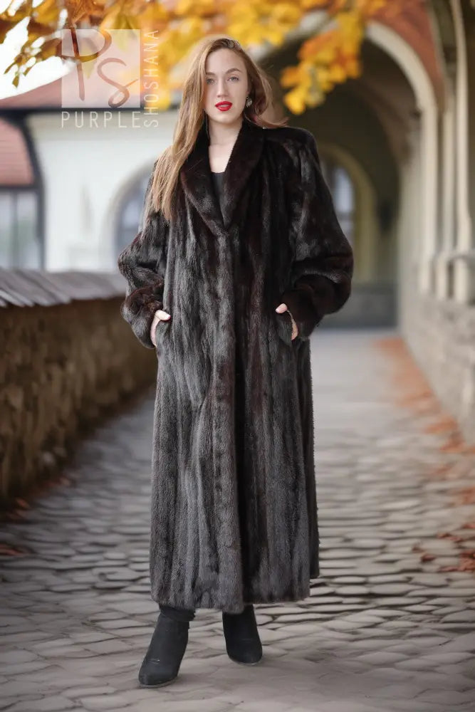 Long black mink fur coat with draped cuffs and a straight, floor-length hem