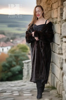 Long black mink fur coat with a front opening and oversized fur sleeves