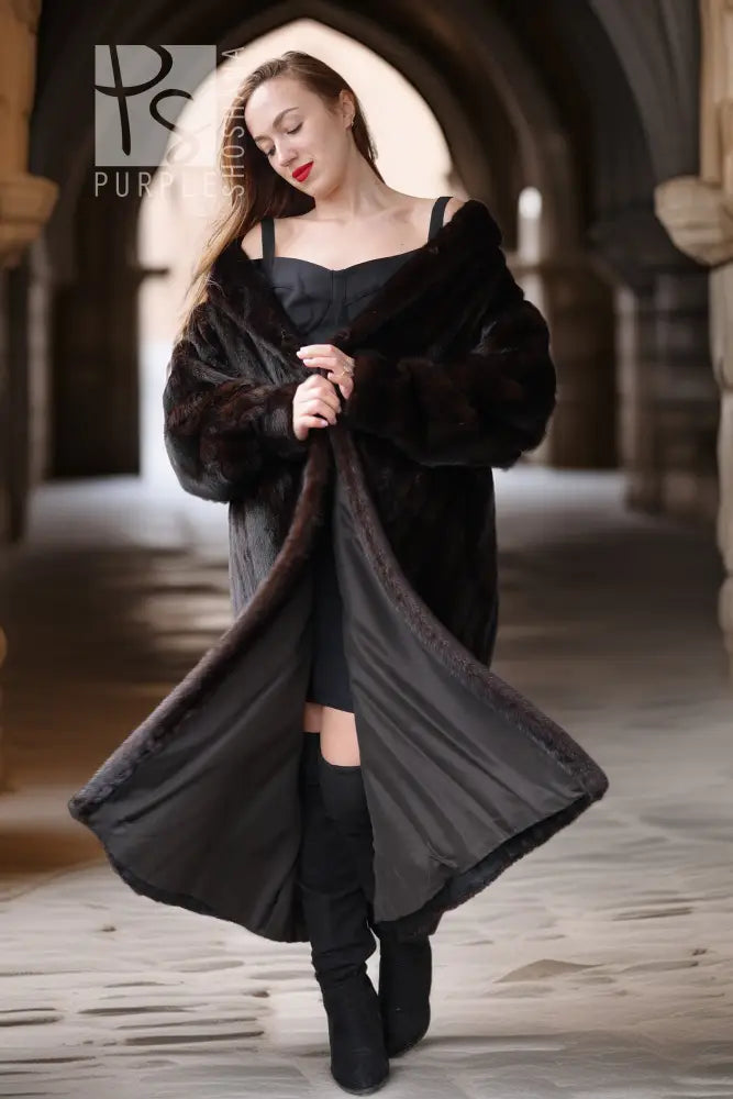 Black mink fur coat with an off-shoulder neckline and a wide open front