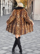 Leopard-print fur coat with black fox-fur collar, back view with full, flared hem