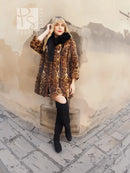 Leopard-print fur coat with dark fox-fur collar, flowing short silhouette with black boots
