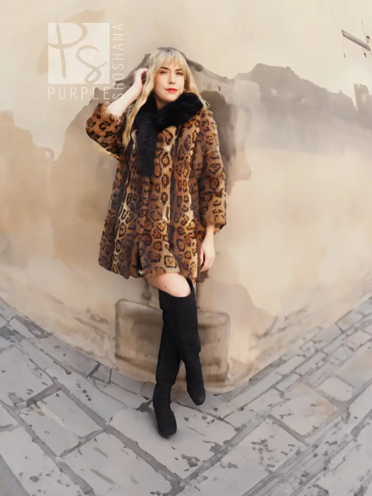 Leopard-print fur coat with dark fox-fur collar, flowing short silhouette with black boots