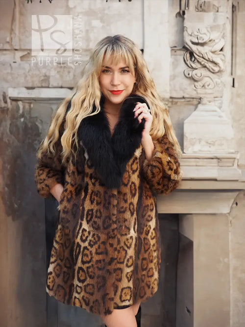 Leopard-print fur coat with black fox-fur collar, close front view, warm brown pattern