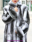 Chinchilla fur coat with thick collar and long textured cuffs, close-up front