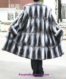 Chinchilla fur coat back view with rounded cape shoulders and flared hem