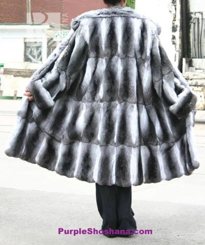 Chinchilla fur coat back view with rounded cape shoulders and flared hem