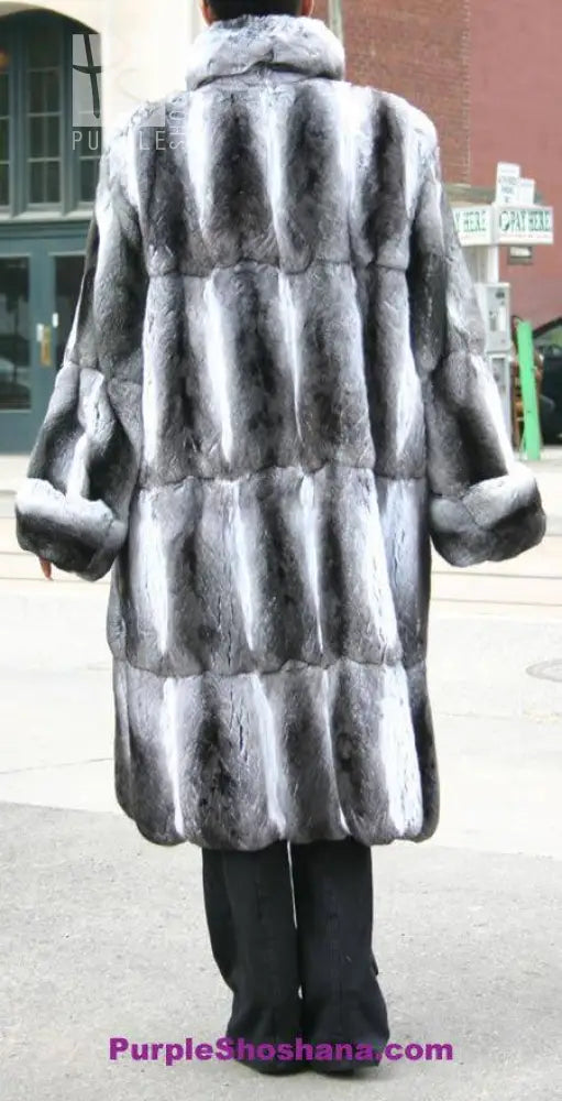 Chinchilla fur coat from back view with full hood and flared skirt hem