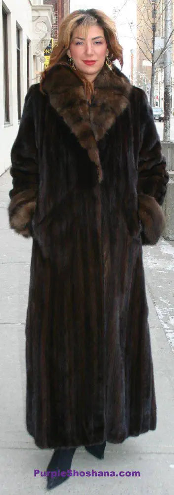 Women’s dark brown mink fur coat with wide collar and long sleeves, front view.