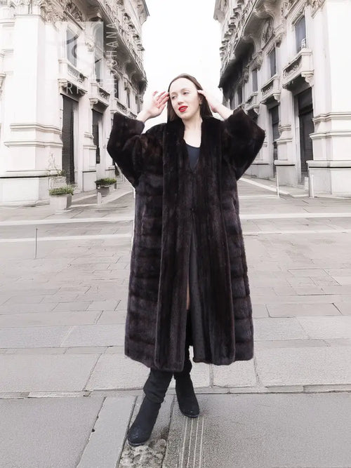 Dark brown mink fur coat with horizontal stripe texture, long sleeves, and full front