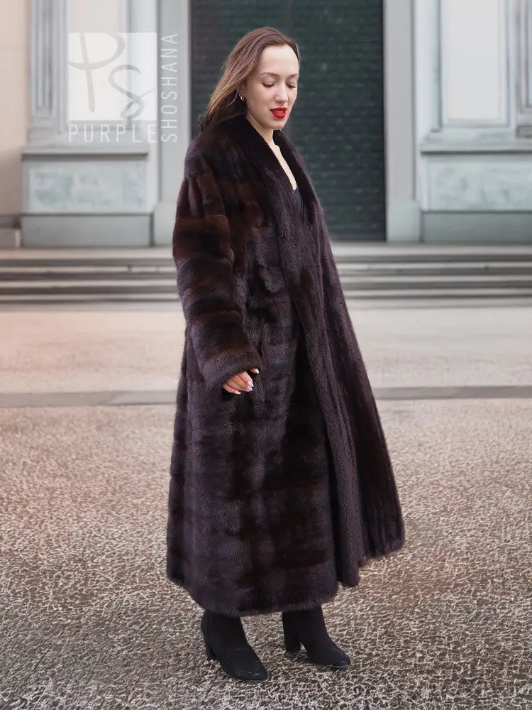 Dark brown mink fur coat with horizontal stripe pattern and long straight silhouette
