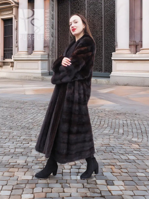 Dark brown mink fur coat with wide collar, wrap-like tuxedo front, and straight hem