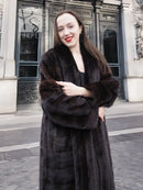 Dark brown mink fur coat with tuxedo lapels, long sleeves, and horizontal stripe pattern