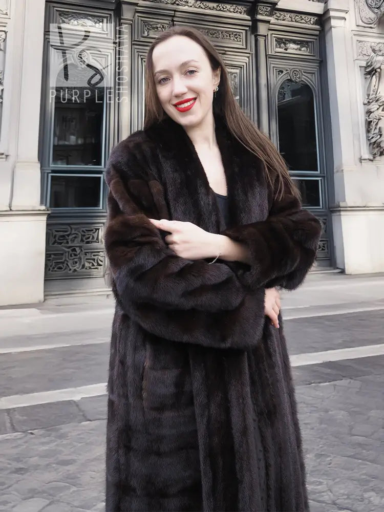Dark brown mink fur coat with tuxedo lapels, long sleeves, and horizontal stripe pattern