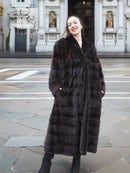 Dark brown mink fur coat with tuxedo V neckline, vertical pocket detail, and stripes