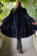 Midnight Iris coat back view, dark navy sheared beaver, flared hem, long sleeves.