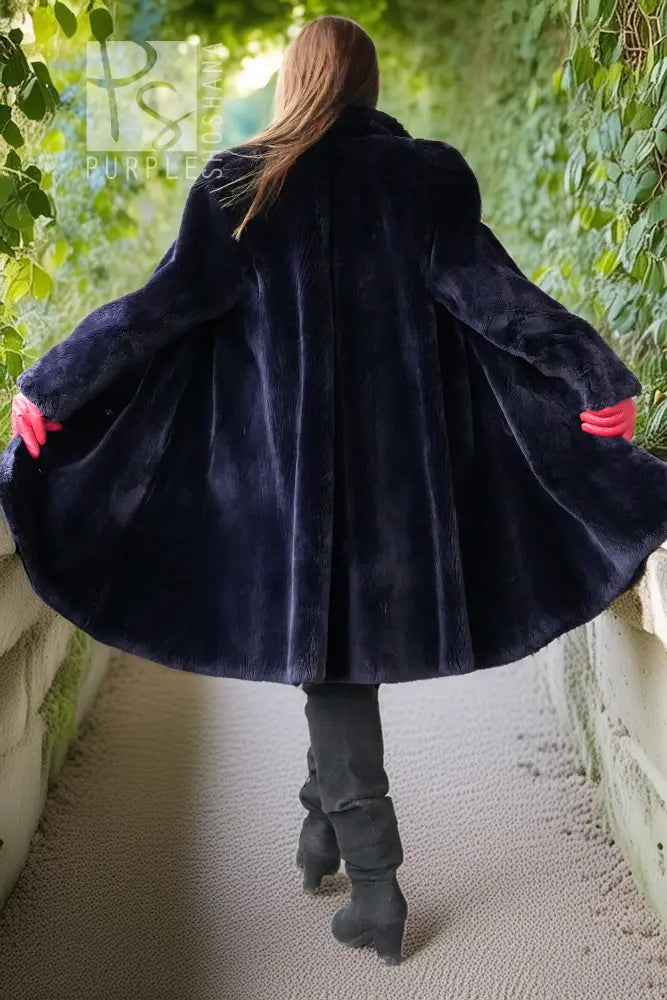 Midnight Iris coat back view, dark navy sheared beaver, flared hem, long sleeves.
