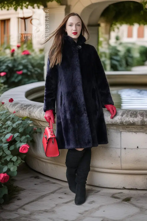 Midnight Iris coat, dark navy sheared beaver, stand collar, button front, relaxed fit.