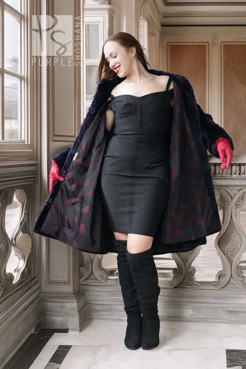 Sheared beaver coat in navy with open front, red-lined cuffs, off-shoulder dress