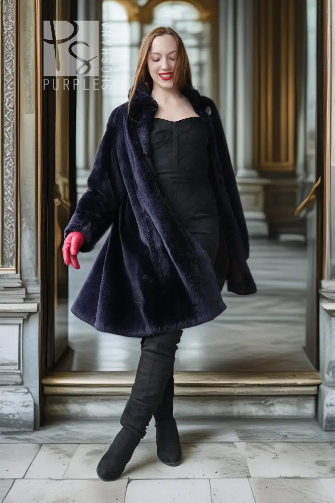 Sheared beaver coat in navy with open front, red-lined cuffs, midi-length flare hem