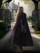 Full-length mink coat in dark fur, flowing back view with wide sleeves