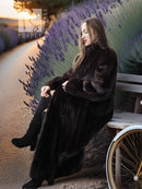 Dark mink coat with high collar and full-length swaying skirt detail