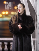Black mink coat with textured sleeves and high rounded collar