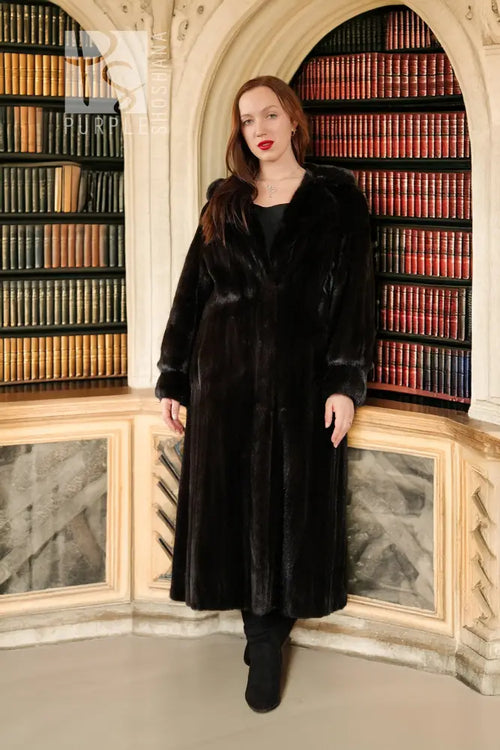 Black hooded mink coat standing front view, long silhouette, button closure