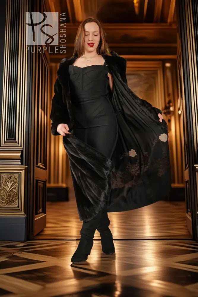 Black hooded mink coat with off-shoulder neckline, long hem and wide sleeves