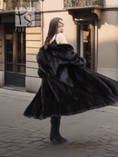 Black mink coat with fur hood and flared skirt hem, back view