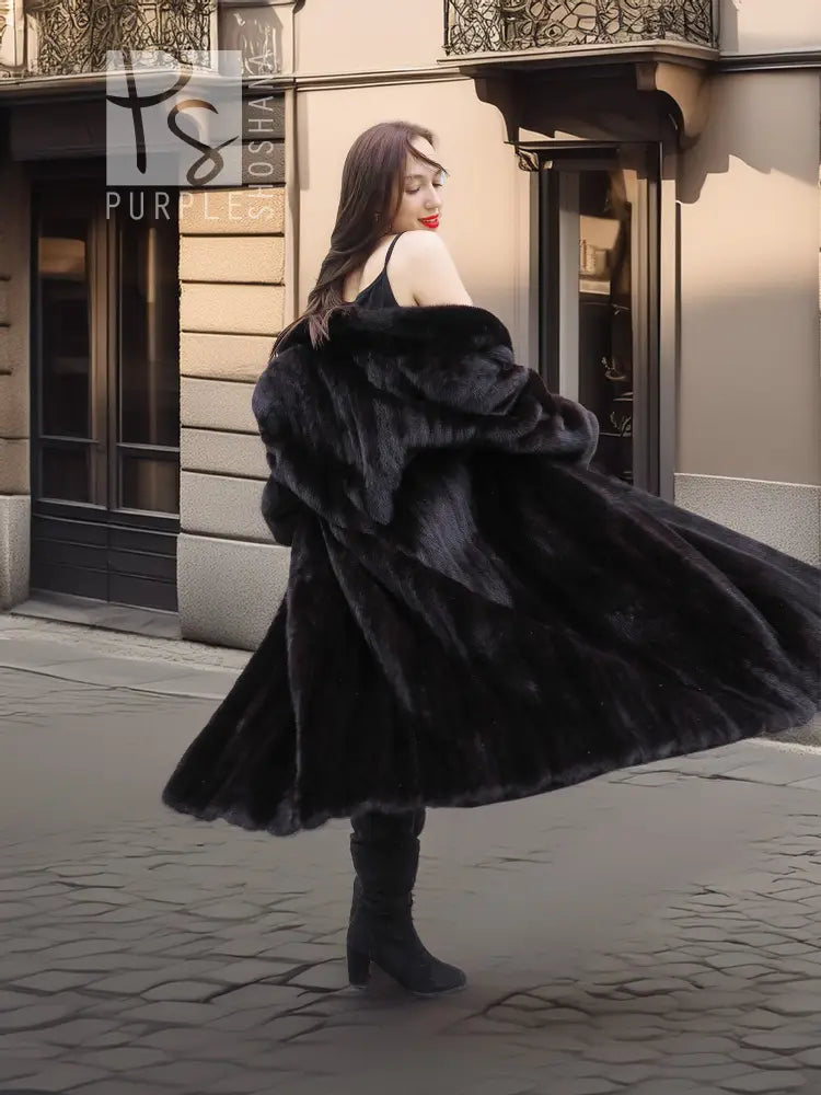 Black mink coat with fur hood and flared skirt hem, back view