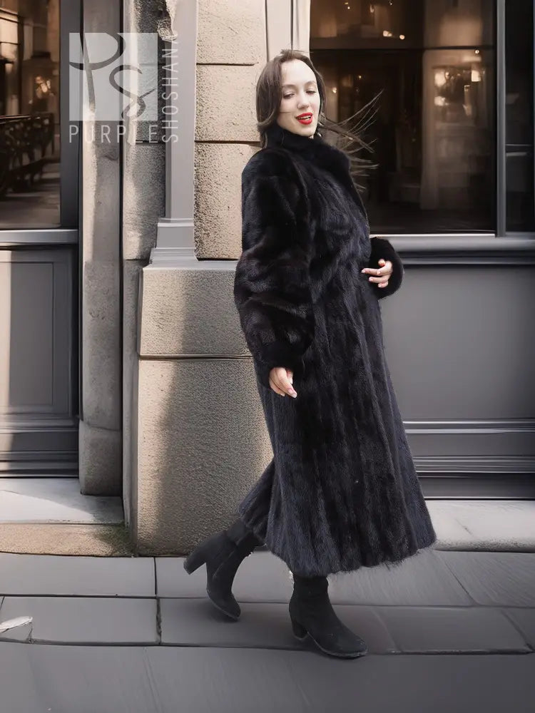 Black mink coat with fur hood and long, flowing hem; side profile