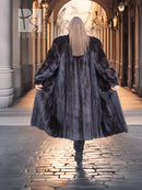 Black mink coat with hood and flared long hem, back view