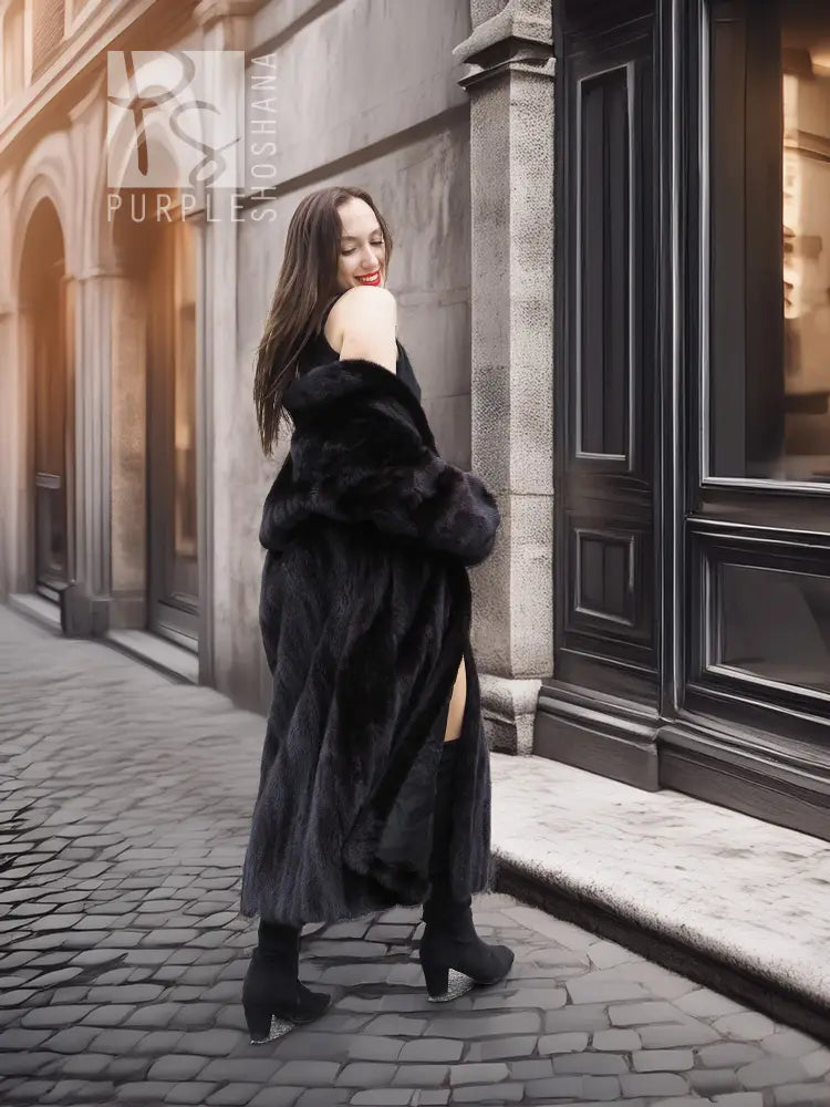 Black mink coat with hood and wide collar, side view with open back hem