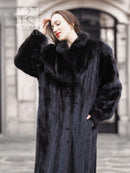 Black mink coat with raised fur collar and hood, buttoned front