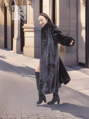 Black mink fur long coat with open front and full sleeves, standing side view.