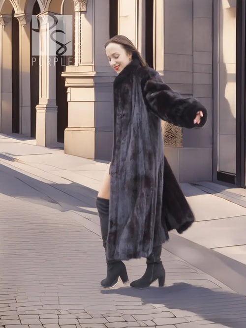 Black mink fur long coat with open front and full sleeves, standing side view.