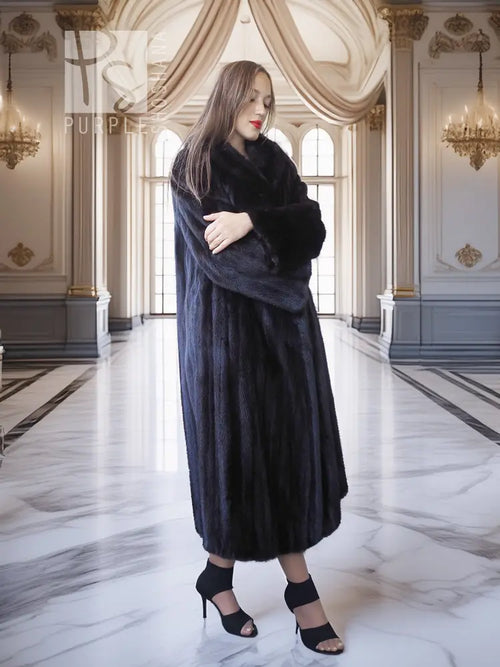 Black mink coat, long mid-calf length with open front styling and voluminous fur sleeves.