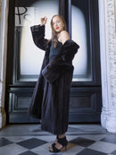 Black mink coat, full-length with belt-like waist and open front, standing pose