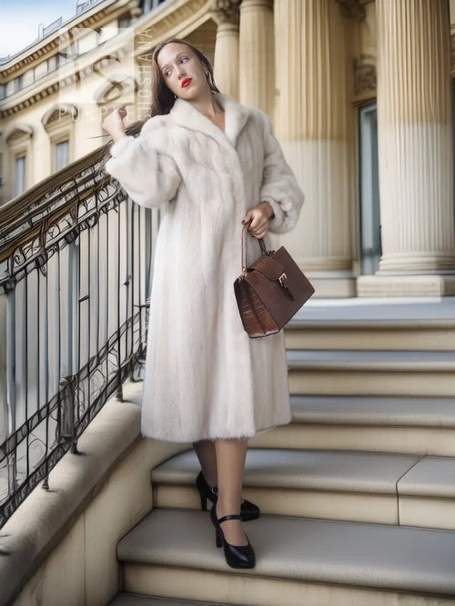 White fur coat with wide collar and long sleeves, knee-length, front open