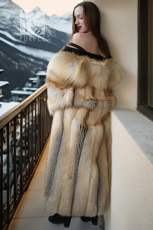 Long fox fur coat with off-shoulder style look, tiered striped texture