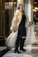 Golden island fox fur coat with wide lapels and long flowing hem; gray cuff trim