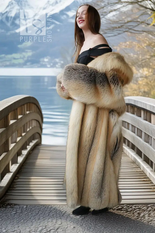 Long golden fox fur coat with wide sleeves and darker gray cuff trim
