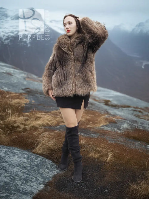 Brown faux-fur jacket with high collar and long sleeves, back-swept hair and stance pose.